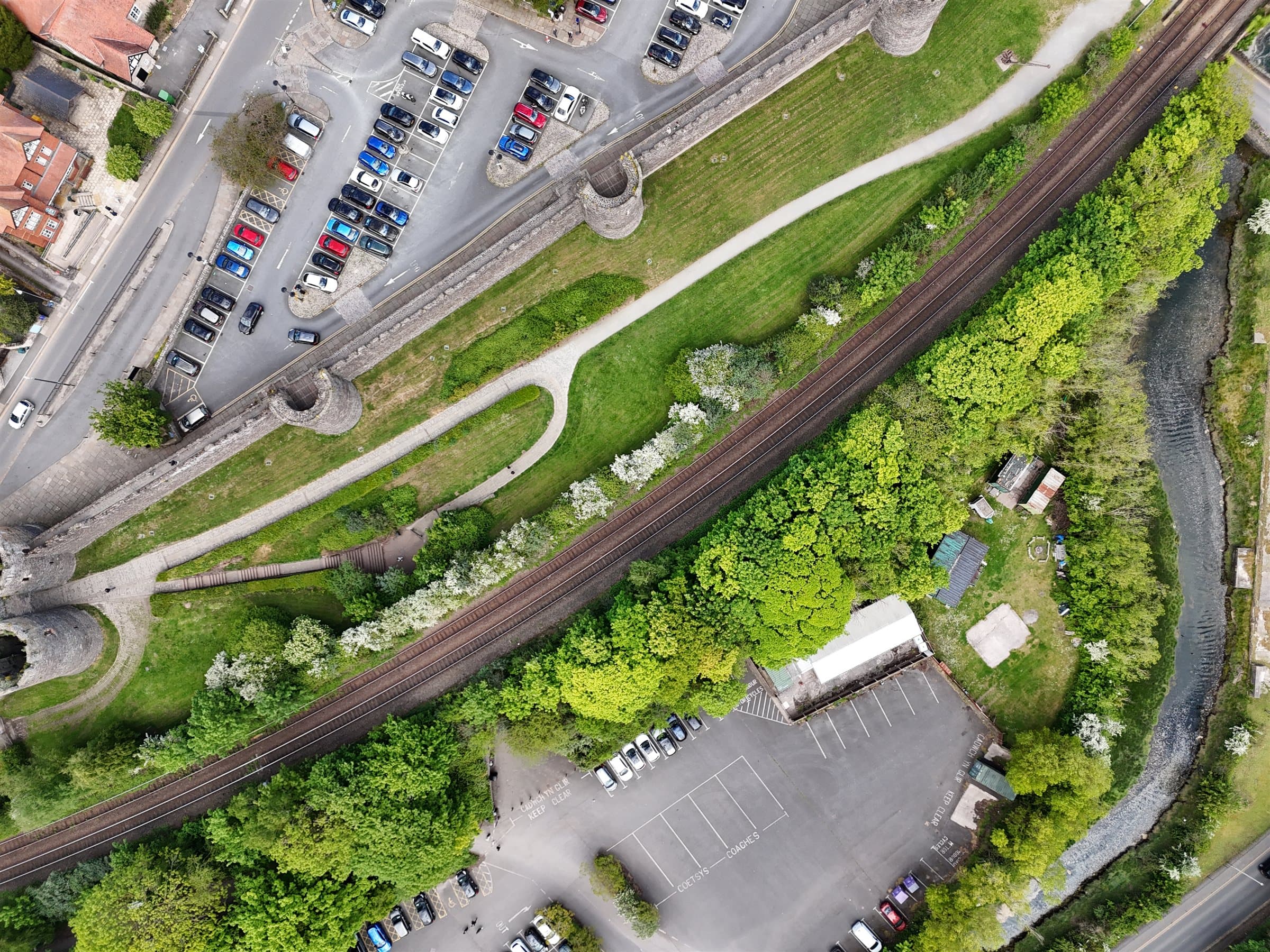 Top-down railway/parking view near the castle